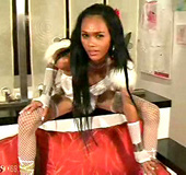 Ladyboy in white fishnets sucks on his own dick