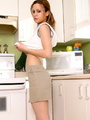 Redhead pulls her panties up into her - Picture 1