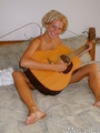 Hot teen gets off playing guitar in the - Picture 4