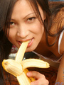 Teen giving a banana blowjob while - Picture 6