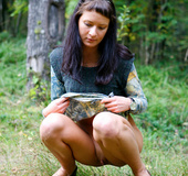 Spying after a brunette kitty pissing in the woods