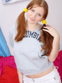 Pigtailed redhead teen slips out her - Picture 2