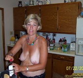 Mature blonde housewife in red peignoir posing on&hellip;