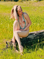 Hot girl in beads posing nude outdoors - Picture 4