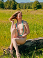 Hot girl in beads posing nude outdoors - Picture 12