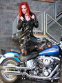 Bodacious red chick in a black trench - Picture 1