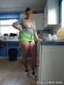 Blonde housewife in a green skirt and - Picture 1
