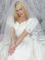 Blonde bride in a dress and stockings - Picture 3