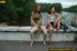 Two hot young chicks walking along river stop to pee in public