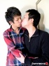 Handsome Japanese in blue and red shirt makes out with his skinny boyfriend