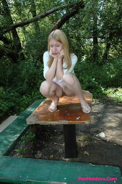 Prankish babe pisses onto a table in the park - XXXonXXX - Pic 10