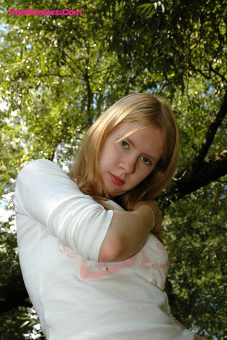 Prankish babe pisses onto a table in the park - XXXonXXX - Pic 16