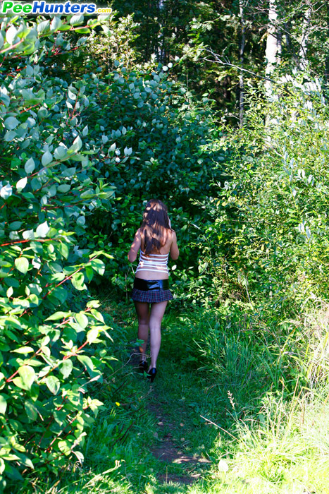 Cute young chick in checkered mini pisses outdoors - XXXonXXX - Pic 16