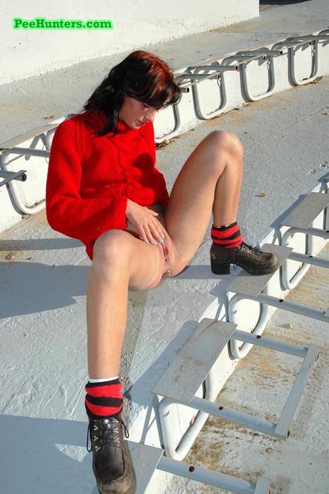 See a cute teen redhead pissing at the stadium - XXXonXXX - Pic 8