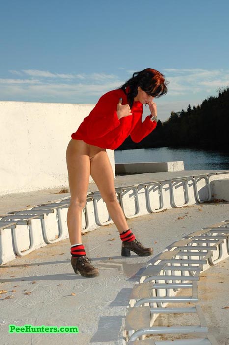 See a cute teen redhead pissing at the stadium - XXXonXXX - Pic 13