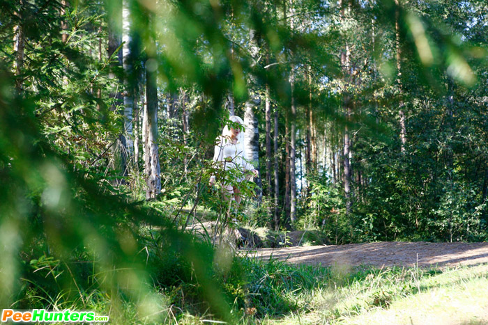 Naughty blonde pisses into a sandpit in forest - XXXonXXX - Pic 1