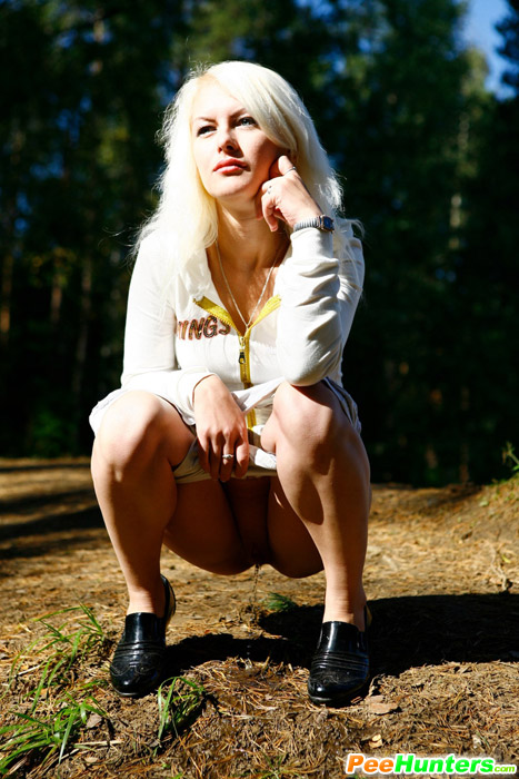 Naughty blonde pisses into a sandpit in forest - XXXonXXX - Pic 9