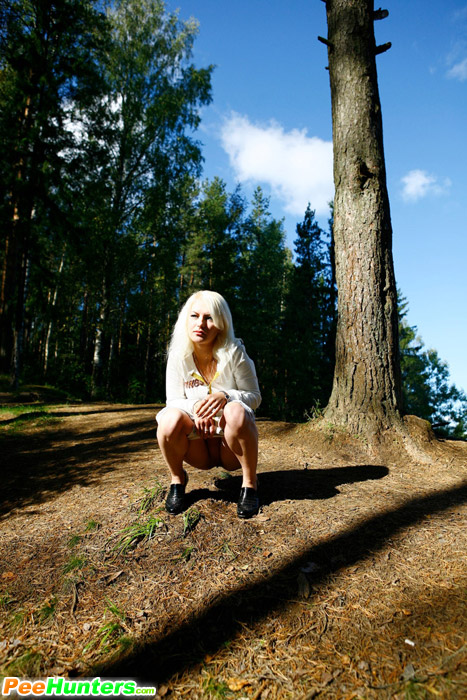Naughty blonde pisses into a sandpit in forest - XXXonXXX - Pic 10