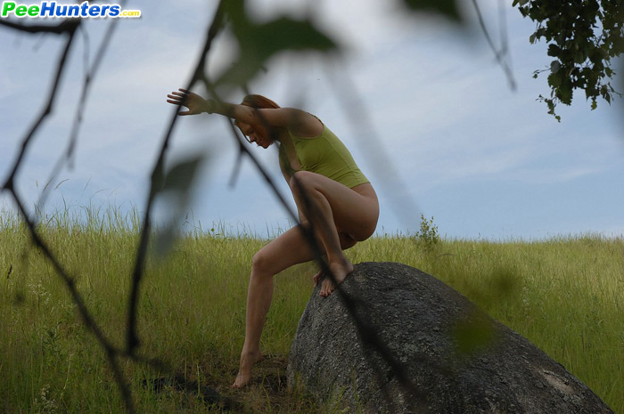 Babe tinkles on a rock in the middle of a field - XXXonXXX - Pic 8