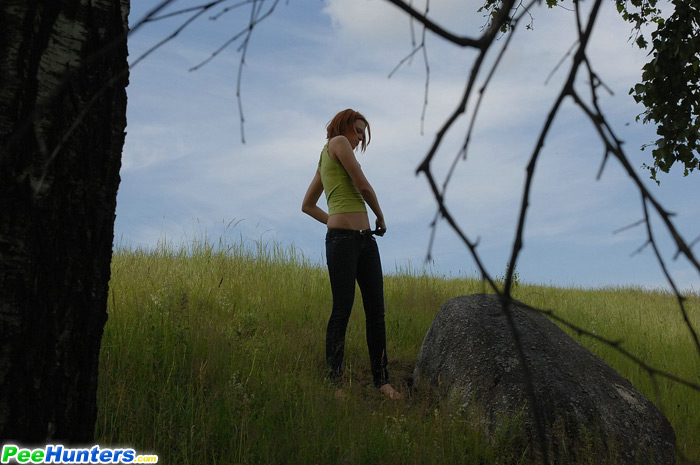Babe tinkles on a rock in the middle of a field - XXXonXXX - Pic 13