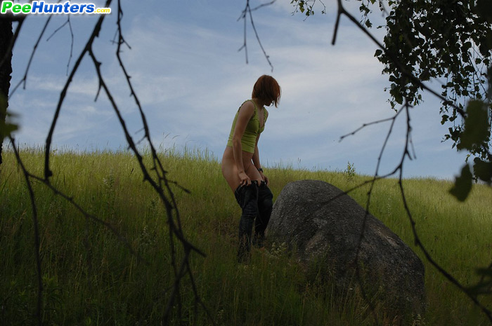 Girlie takes a leak sitting on top of a huge rock - XXXonXXX - Pic 5