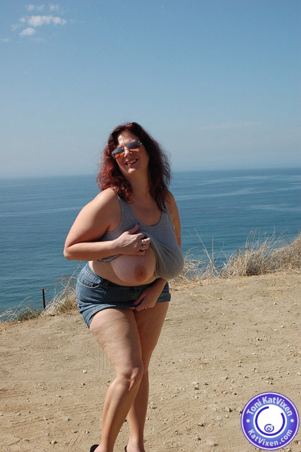 Busty redhead flashes her tits to the ocean - XXX Dessert - Picture 13