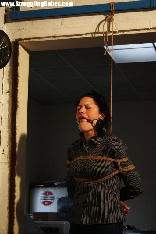 Brunette gagballed chick in clothes pendula - XXX Dessert - Picture 2