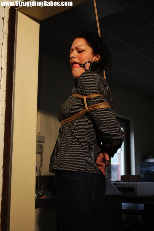 Brunette gagballed chick in clothes pendula - XXX Dessert - Picture 8