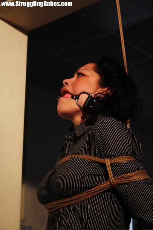 Brunette gagballed chick in clothes pendula - XXX Dessert - Picture 12