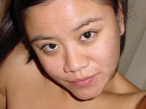 Hot Asian chick posing on her mobile naked through the mirror - XXXonXXX - Pic 1