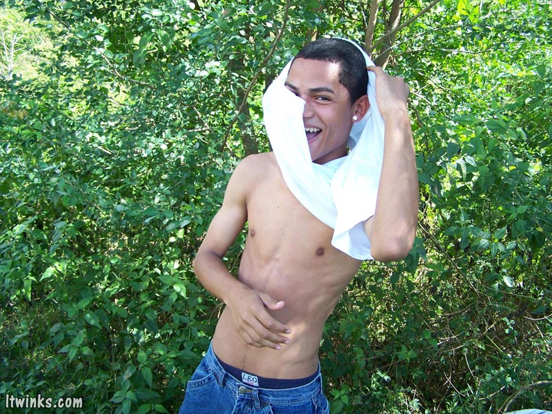 A dark randy latino twink proudly showing his huge equally dark dick among the bushes and blasting cock juice all over his stomach - XXXonXXX - Pic 3