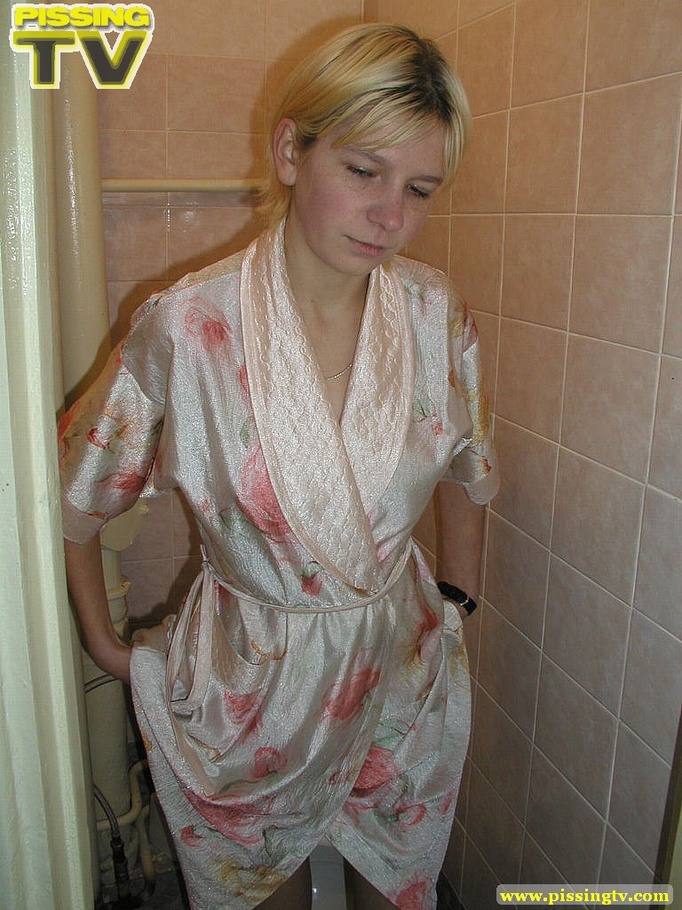 A slutty blonde bitch demonstrates how enjoyable  taking a piss in the toilet can be - XXXonXXX - Pic 4