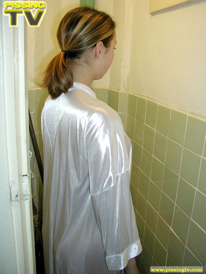 Brunette beauty wearing only a silk robe takes a wonderfully nasty piss inside a very dirty toilet by sitting on the toilet seat - XXXonXXX - Pic 1