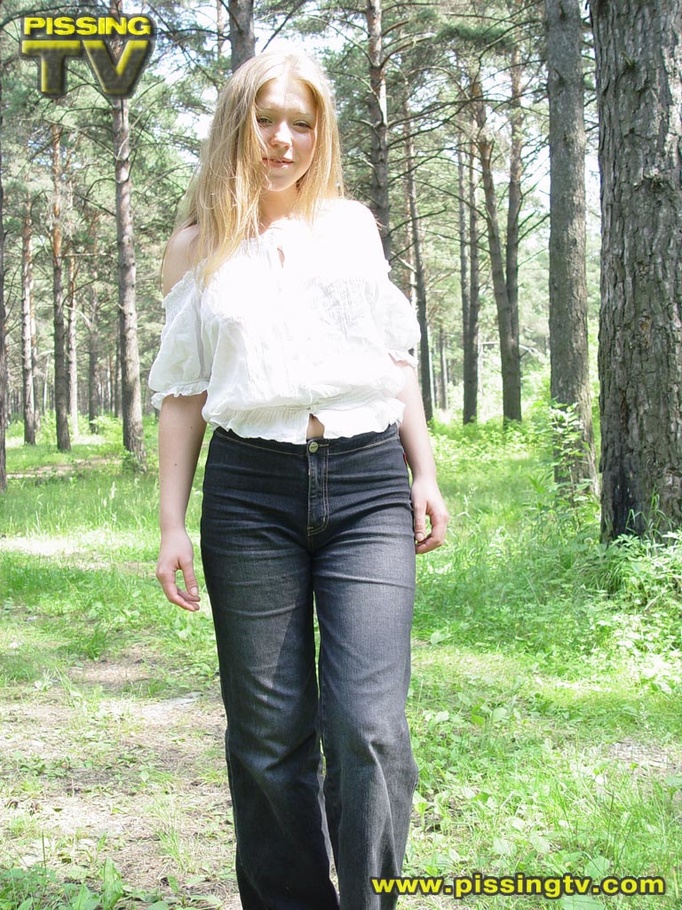 Horny blonde teen pulls down her pants in the forest then takes a glorious piss among the grasses with tips of weeds tickling her ass and pussy - XXXonXXX - Pic 1