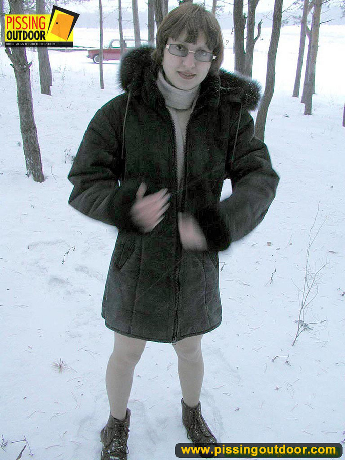 Kinky teen in glass bends to piss in the snow revealing tits and cute bushy pussy - XXXonXXX - Pic 1