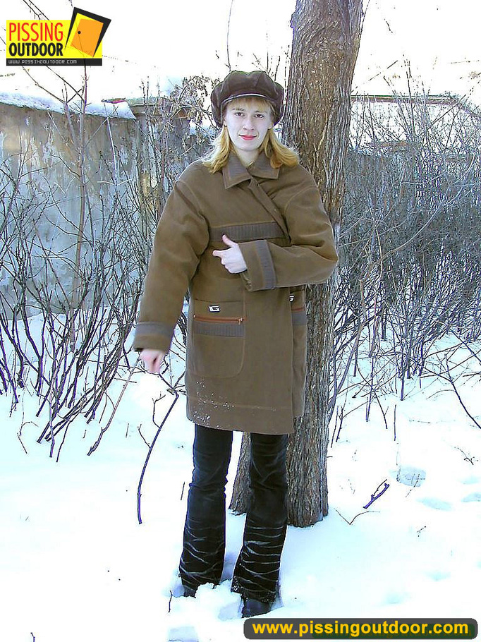 Blonde teen wearing only a coat in winter opens it to stand pissing on the snow - XXXonXXX - Pic 1