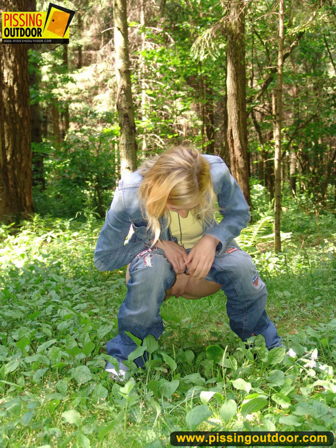 Sexy blonde wearing blue denin and black panties bends low to piss in the woods - XXXonXXX - Pic 6