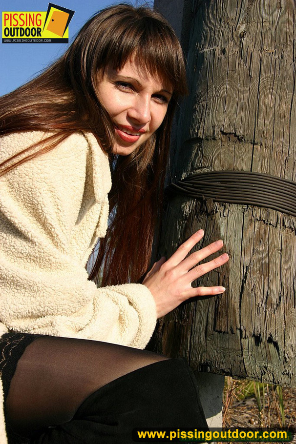 Sexy chick takes erotic poses and stands to pee by a tree out in the woods - XXXonXXX - Pic 15