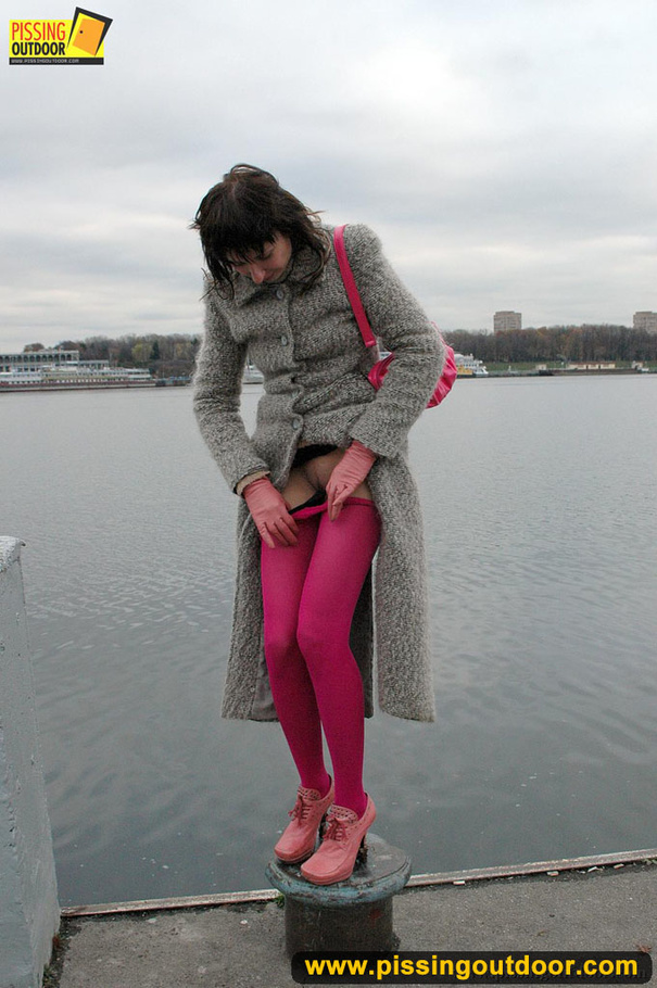 Babe walking outdoors makes a quick stop on an embankment to let out hot piss - XXXonXXX - Pic 5