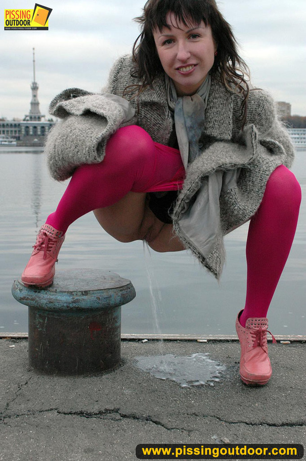 Babe walking outdoors makes a quick stop on an embankment to let out hot piss - XXXonXXX - Pic 14