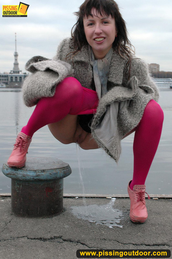 Babe walking outdoors makes a quick stop on an embankment to let out hot piss - XXXonXXX - Pic 15