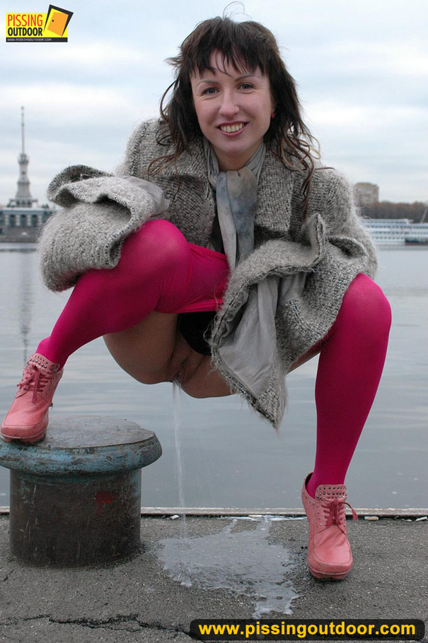 Babe walking outdoors makes a quick stop on an embankment to let out hot piss - XXXonXXX - Pic 16