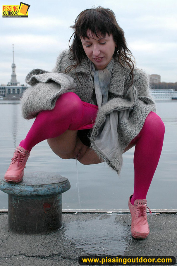 Babe walking outdoors makes a quick stop on an embankment to let out hot piss - XXXonXXX - Pic 18