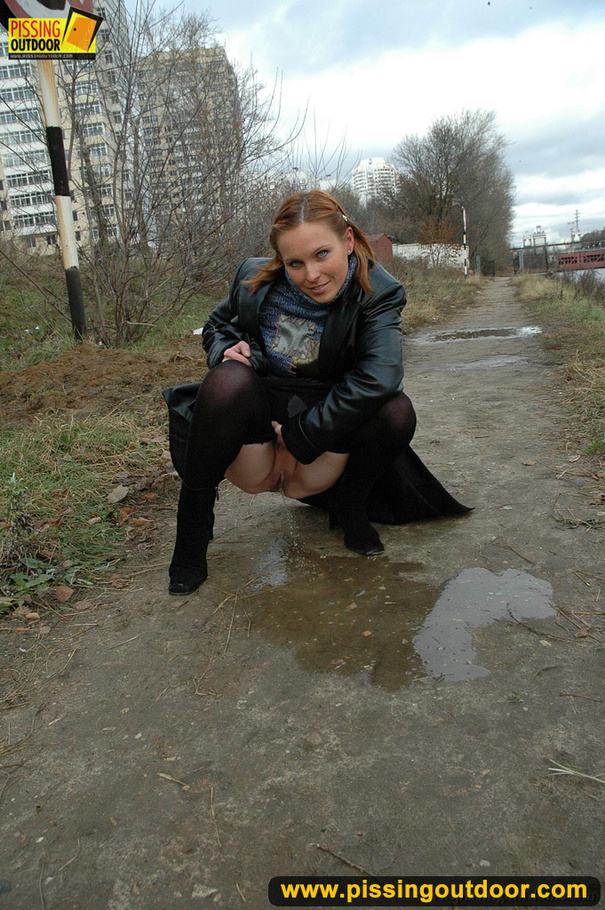 Pretty babe in black leather and stockings stop on road to piss outdoor on asphalt - XXXonXXX - Pic 3