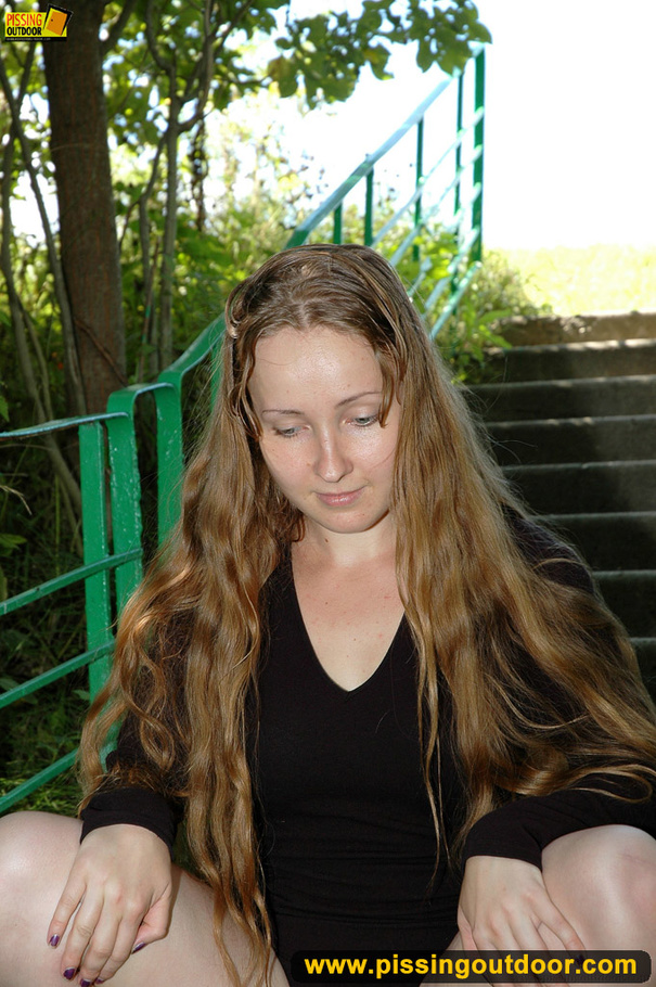 Smiling cute shapely chick in sexy black dress pisses along the park steps - XXXonXXX - Pic 13