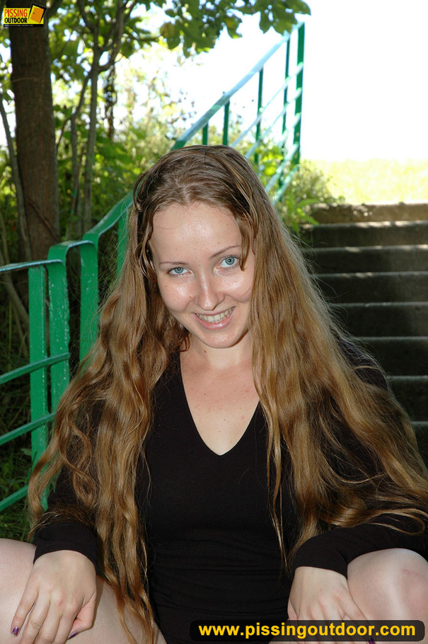 Smiling cute shapely chick in sexy black dress pisses along the park steps - XXXonXXX - Pic 15