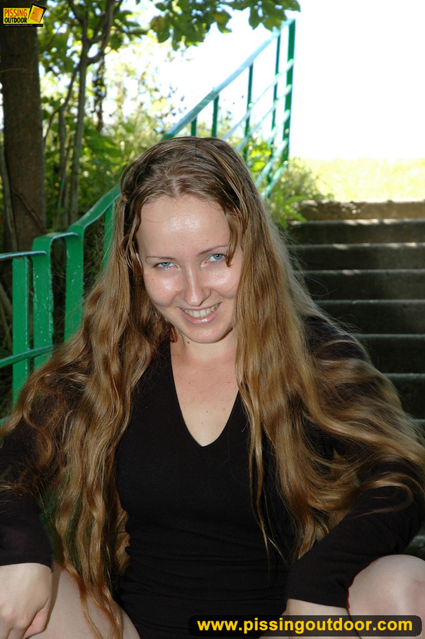 Smiling cute shapely chick in sexy black dress pisses along the park steps - XXXonXXX - Pic 16