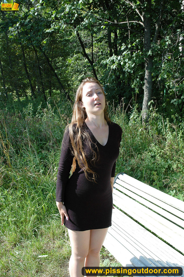 Cute naughty chick on a stroll stops to bend on park bench and spray piss - XXXonXXX - Pic 1