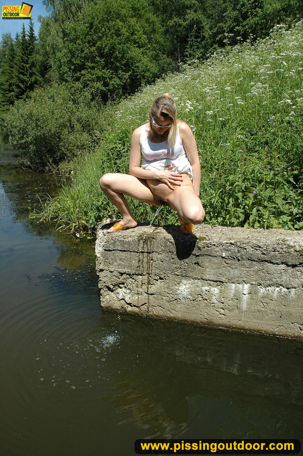 Hot blonde on nature stroll takes hot piss on stone ledge to river below - XXXonXXX - Pic 7