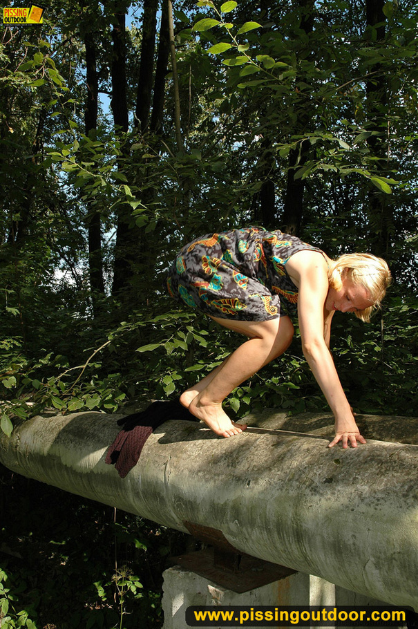 Blonde cute chick in short dress slides panty to the side to spray pee - XXXonXXX - Pic 16